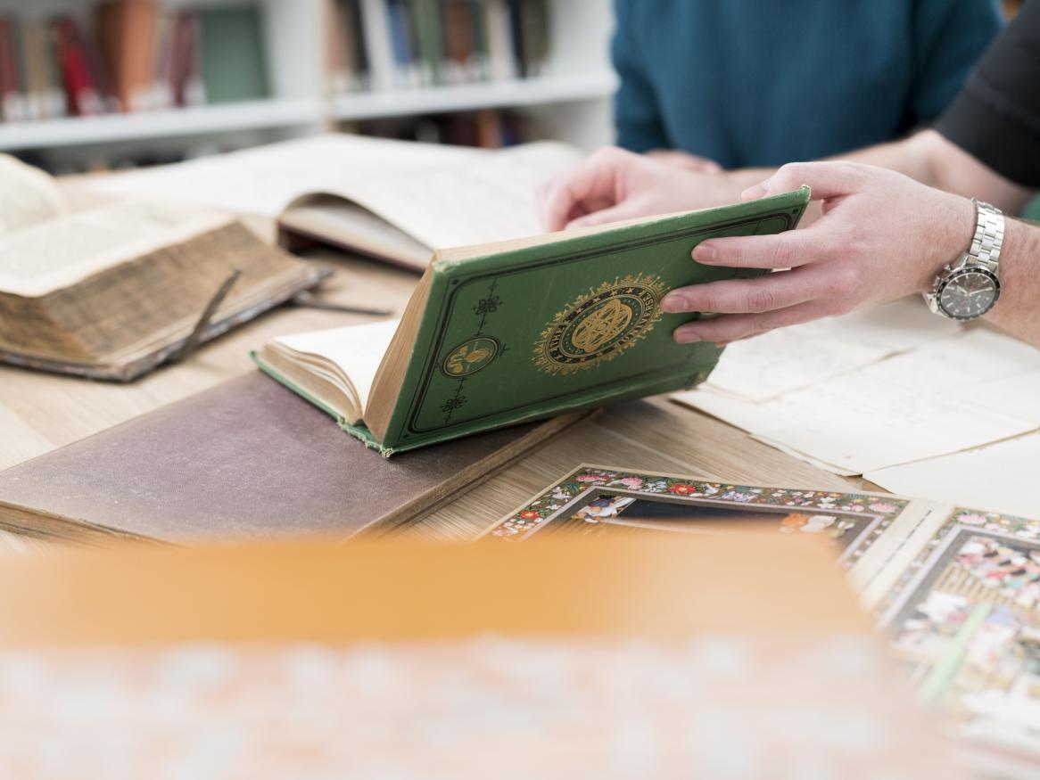 holding a rare book