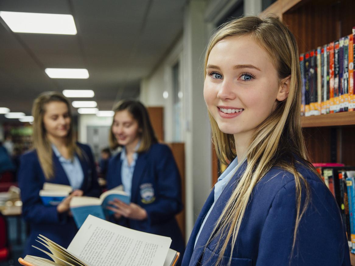 Photo of high school students in library