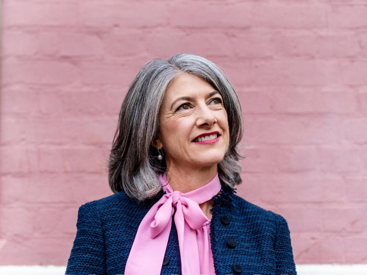 Professor Nicola Spurrier smiling and looking upwards