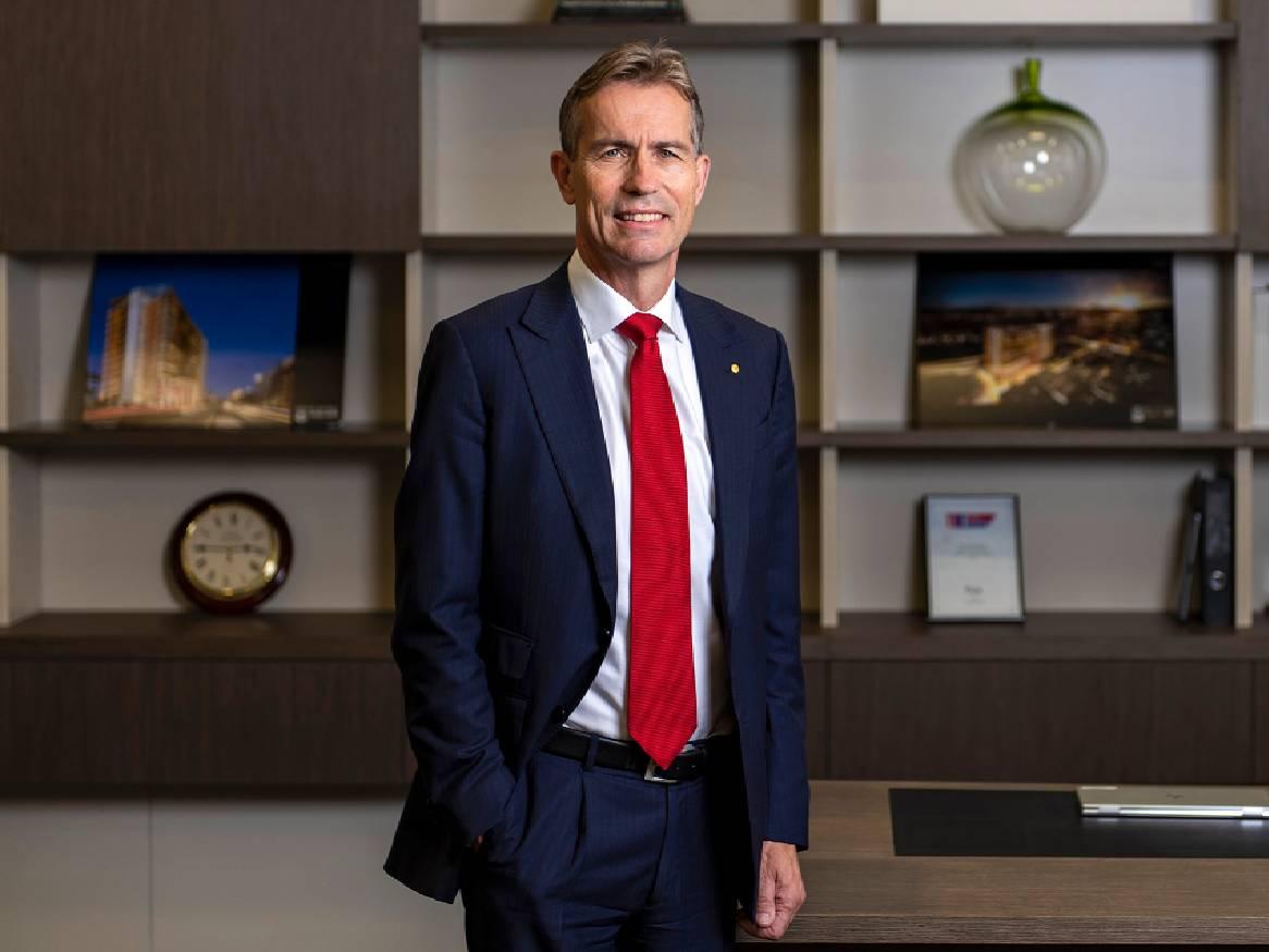 Professor Peter Høj AC stands in an office