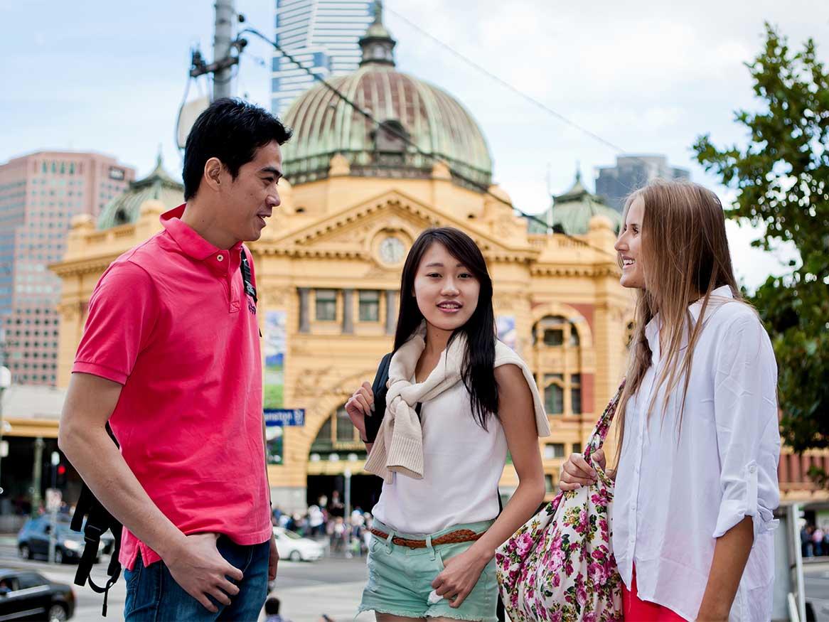 Students in Melbourne outside Flinders Street station