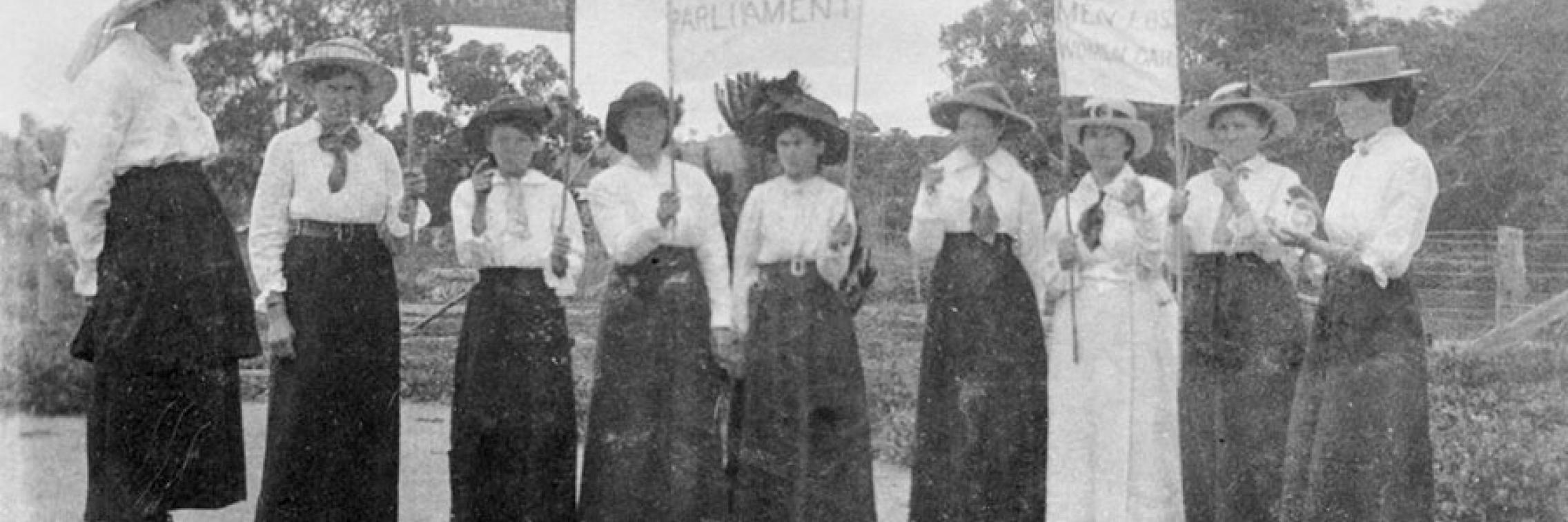 Historical image of women campaigning for suffrage