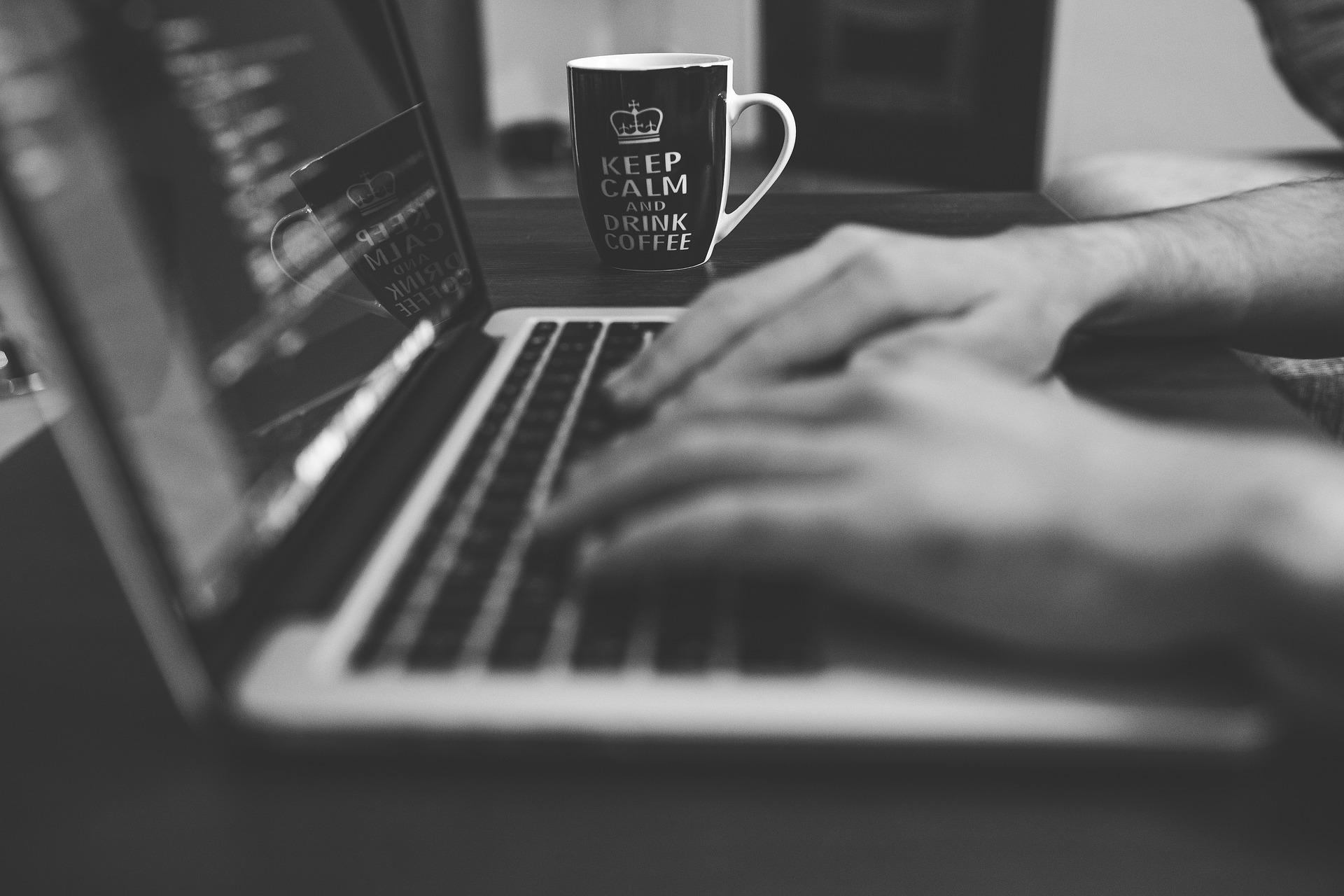 Person typing on laptop