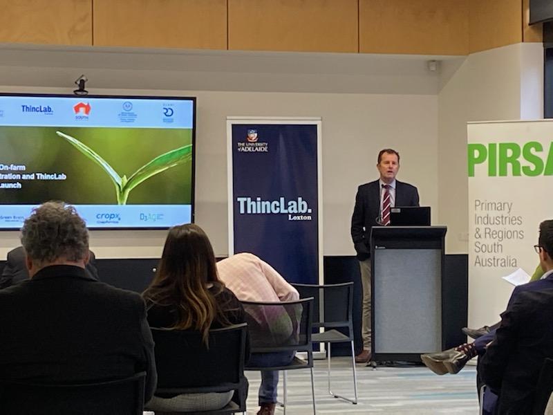 Image of Minister Whetstone speaking from a lectern 