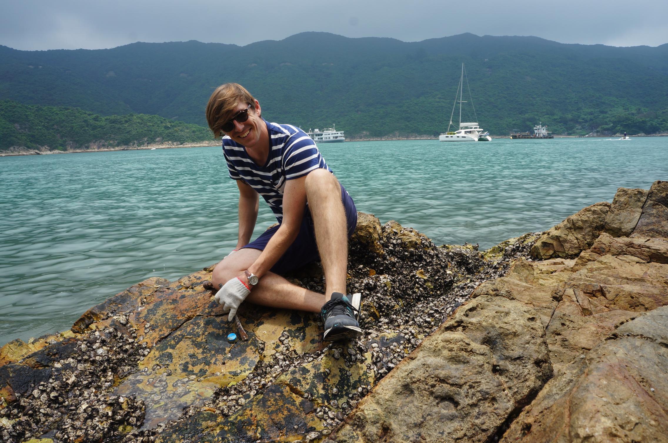 Dr Dominic McAfee working on intertidal oysters