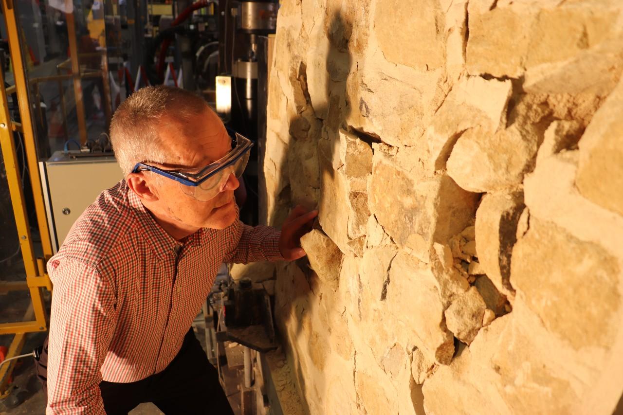 Professor Michael Griffith examining the test wall