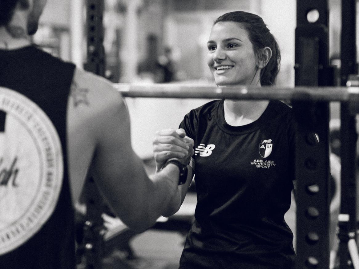 woman working out with personal trainer 