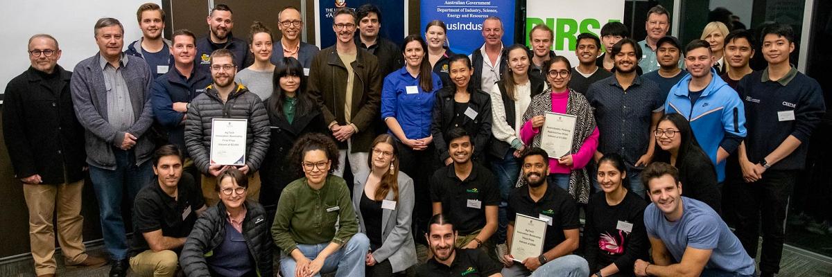 The 2022 AgTech Innovation Bootcamp participants in a group, smiling at the camera.