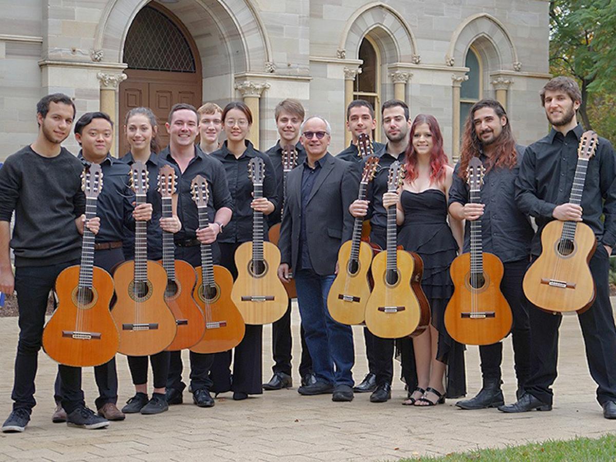 musicians holding guitars outside Elder Hall