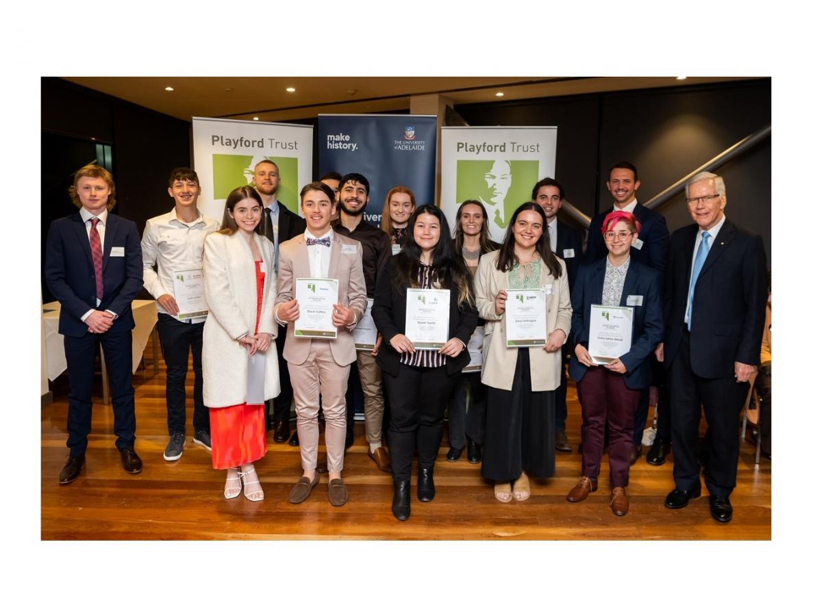 The 14 winners of the Playford Trust mining and petroleum engineering scholarships smile at the camera.