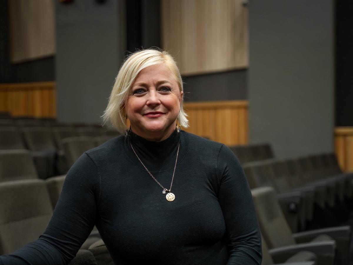 Nikki Snelson smiles, in the Scott Theatre.