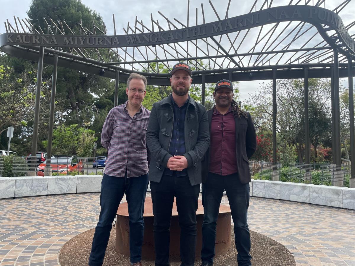 Dr Luke Dollman, Dr Dylan Crismani, Mr Grayson Rotumah smile into the camera.