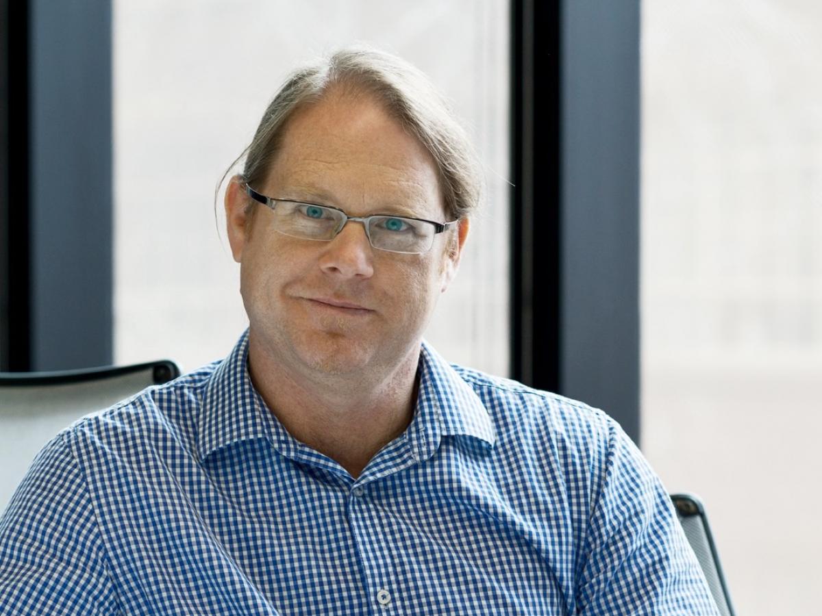 Professor Andre Luiten smiles into the camera.