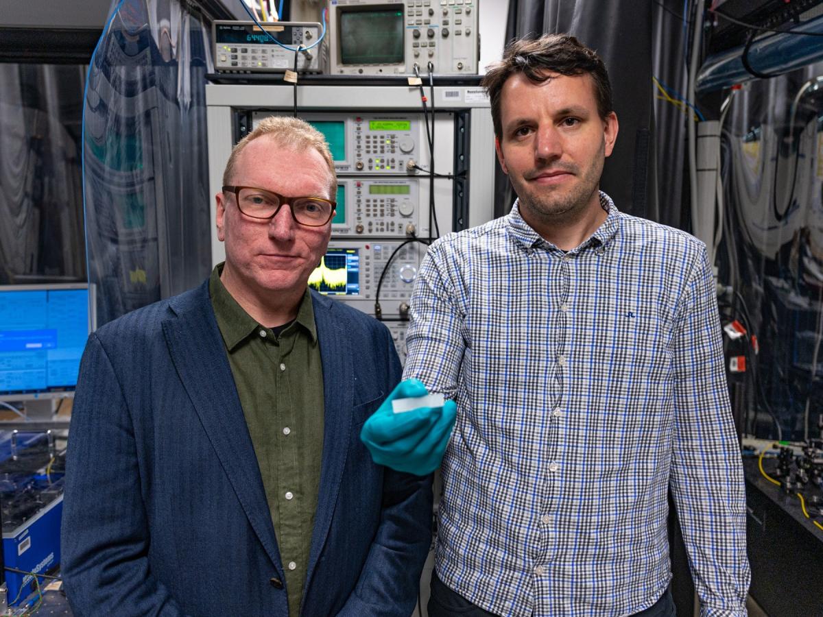Arnan Mitchell and Andy Boes with a photonic chip