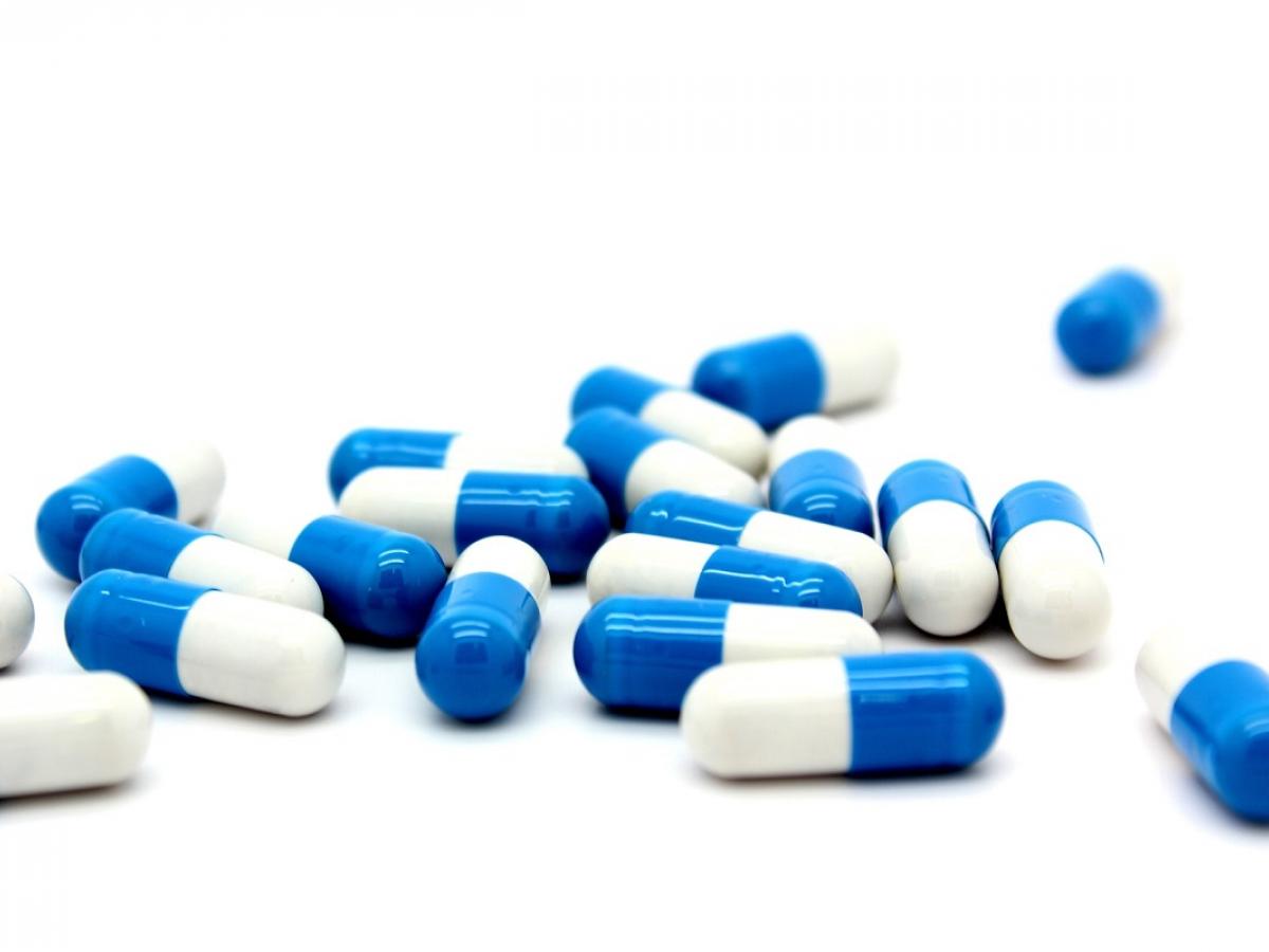 Image of blue and white capsules.