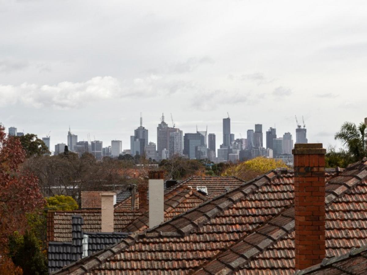 Melbourne CBD skyline with suburban rooftops
