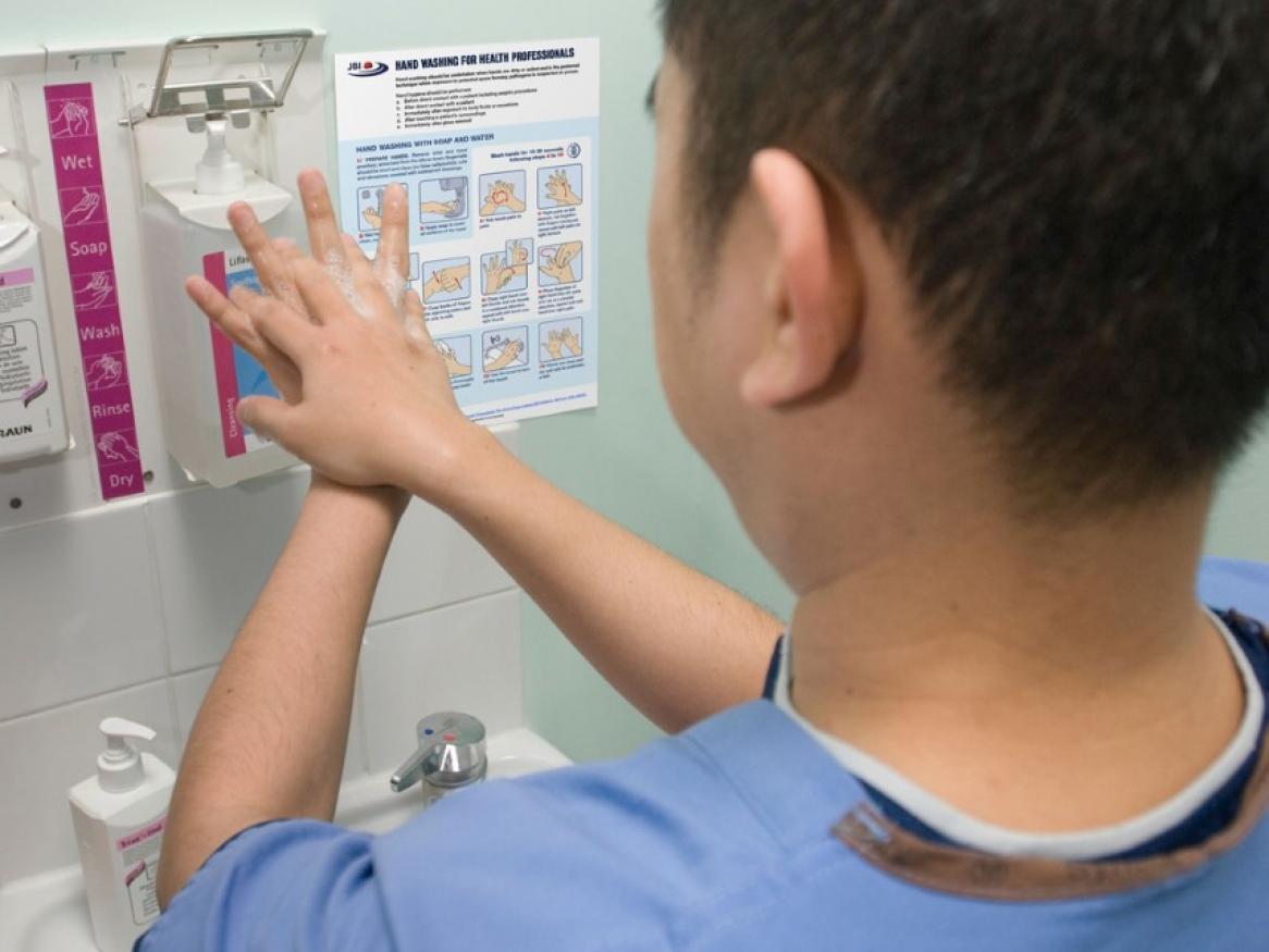 Healthcare worker washing hands