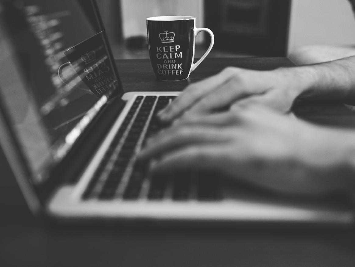 Person typing on laptop