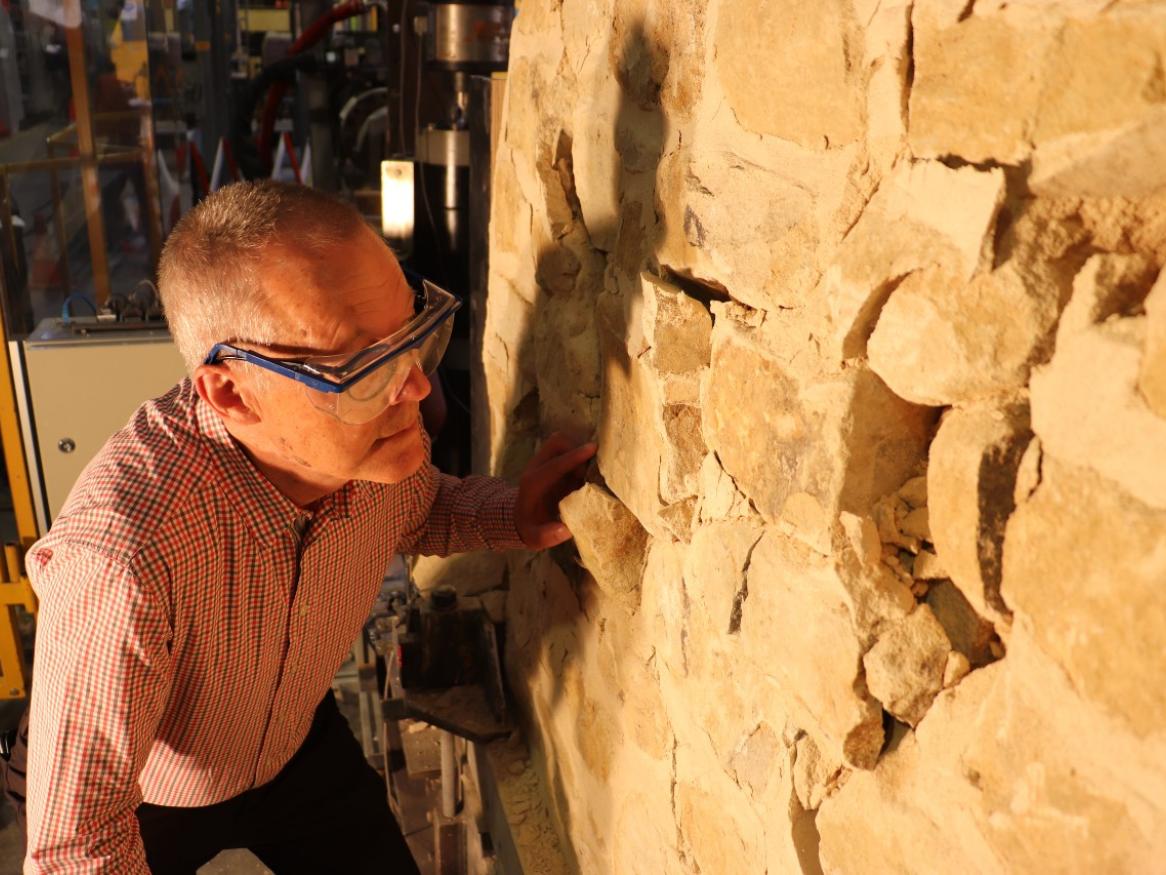 Professor Michael Griffith examining the test wall