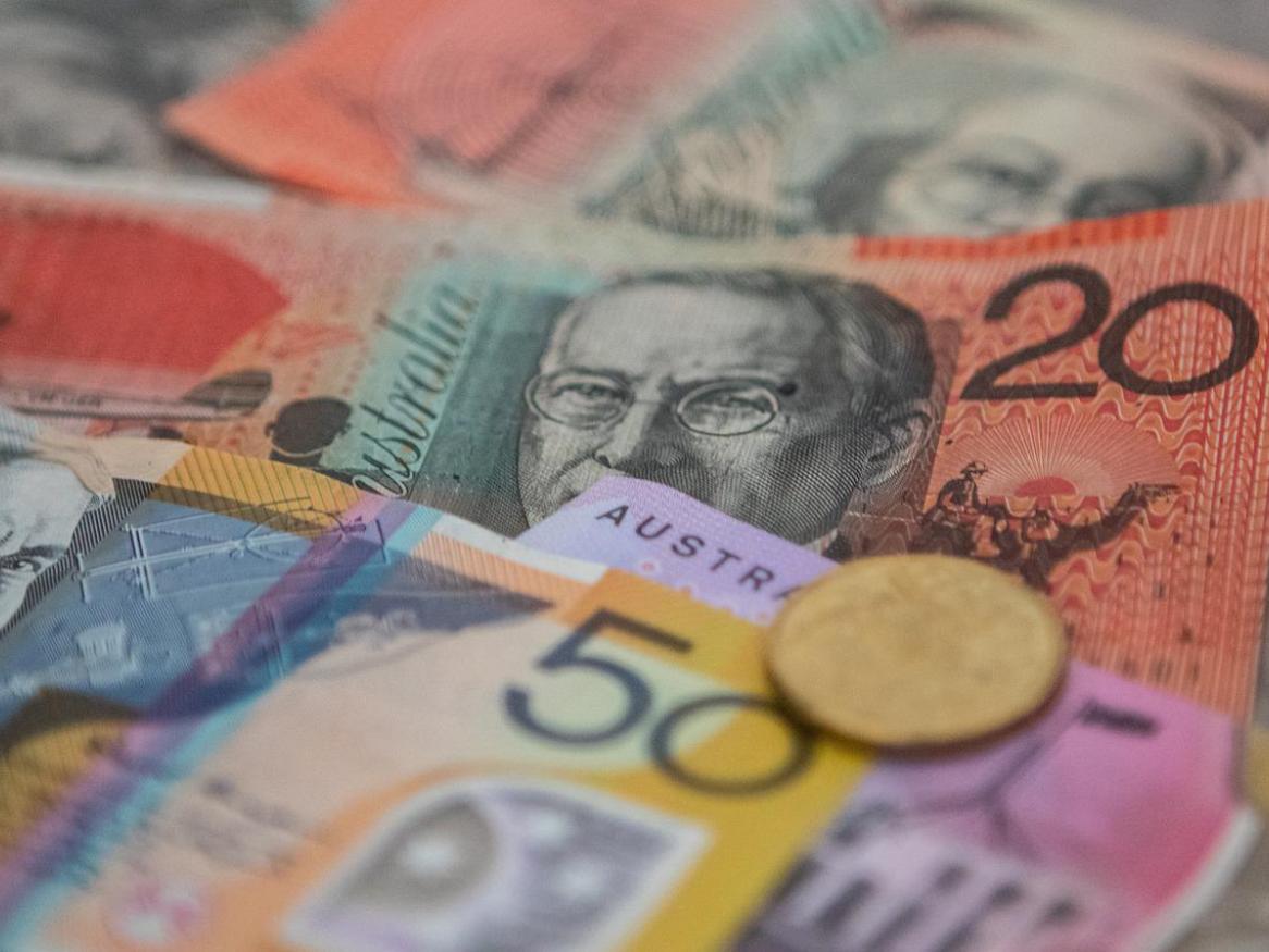 A photo of Australian money, in cash and coin.