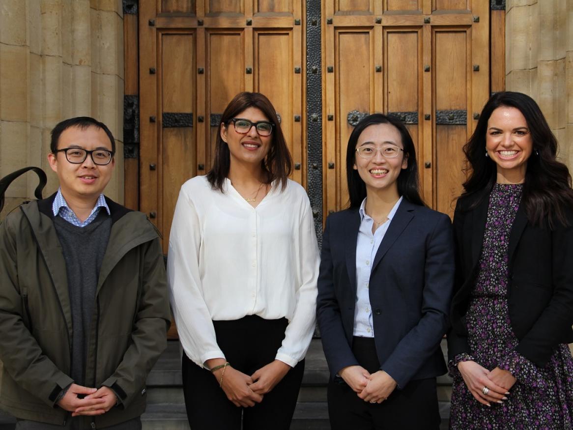 Qi, Zohra, Jiawen, and Tatiana stand and smile at the University of Adelaide.