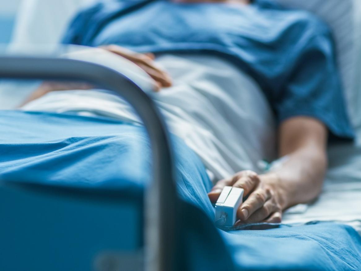 Photo of a person in a hospital bed