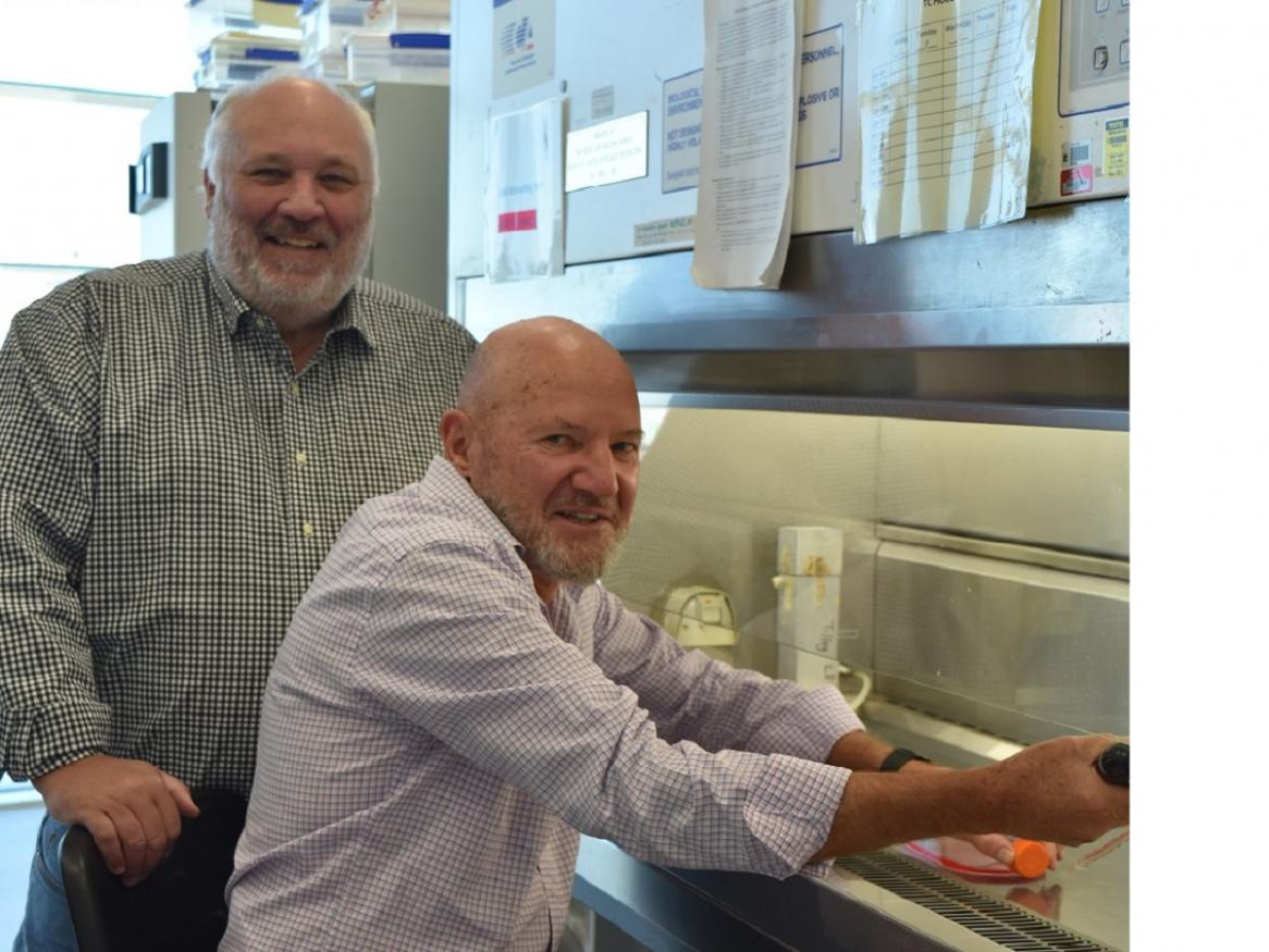 Dr Stephen Birrell and Professor Wayne Tilley inside a lab.