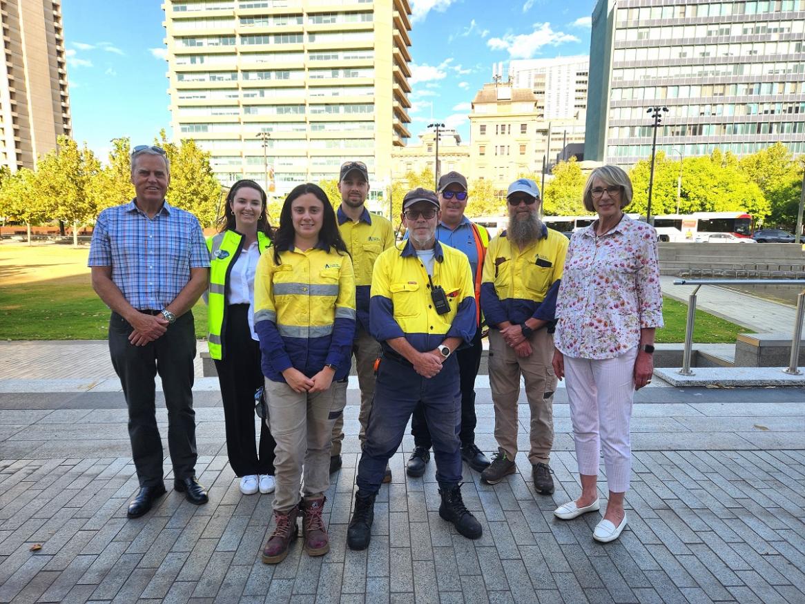 Paul Rothmore standing with City of Adelaide workers and the Lord Mayor in Victoria Square