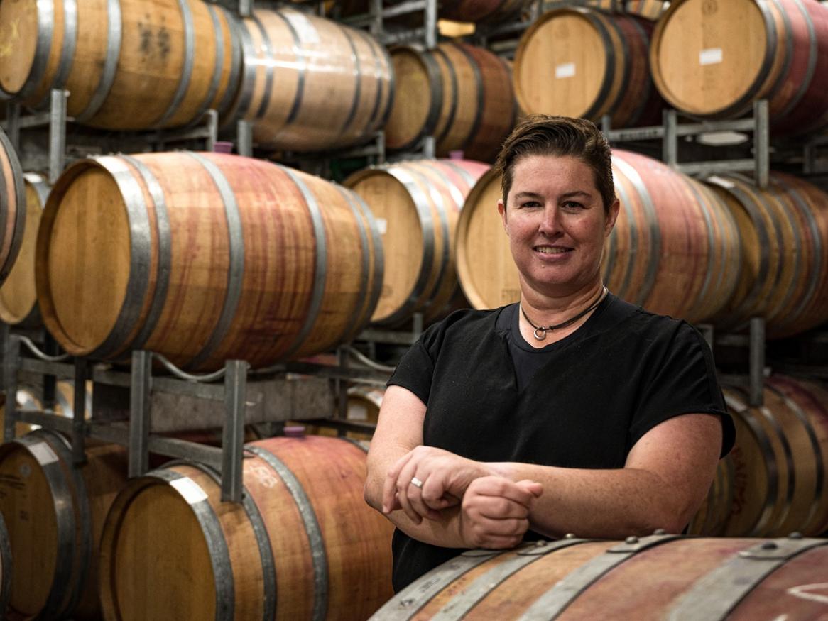 Professor Kerry Wilkinson in a barrel room