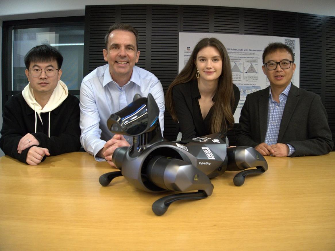 AIML staff and students with a robotic dog