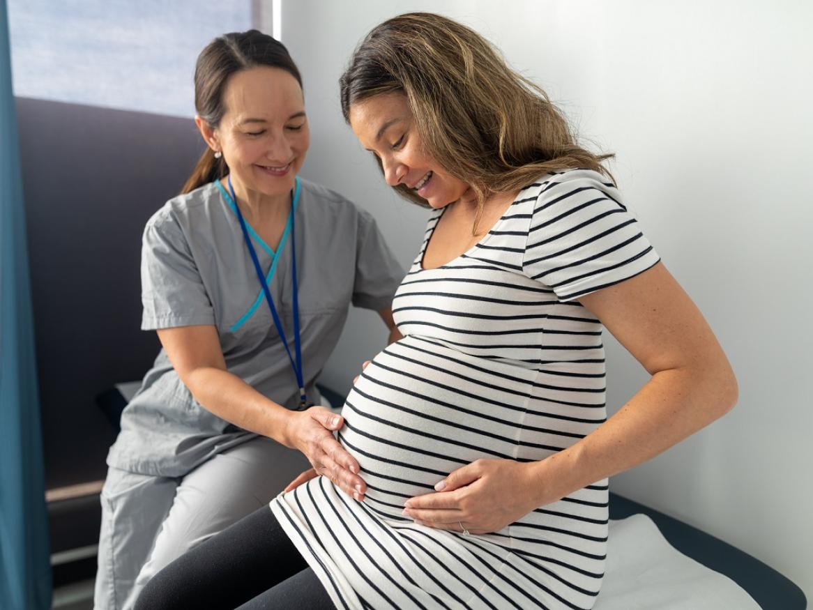 Stock image of pregnant woman with doctor.