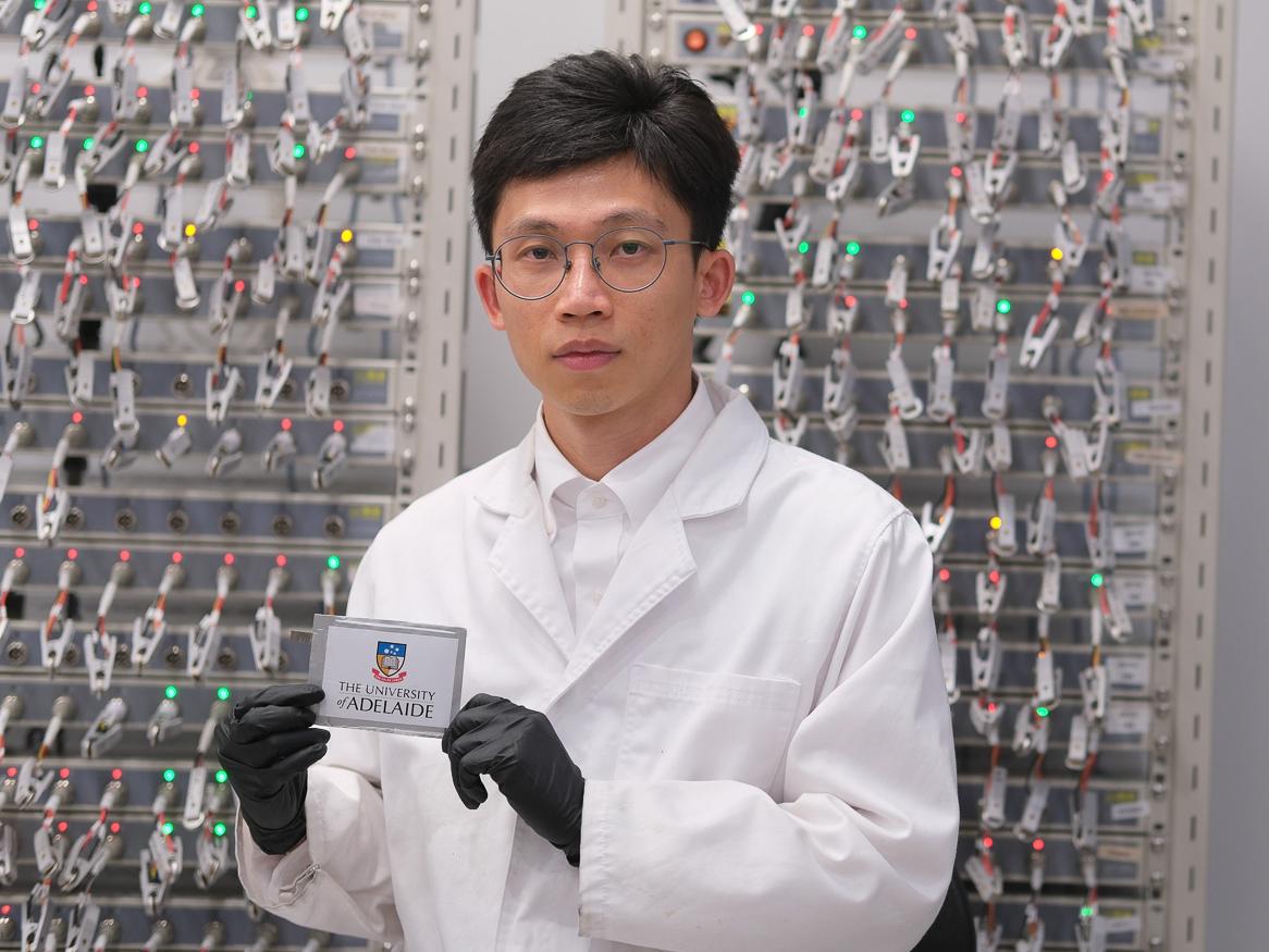 School of Chemical Engineering's Guanjie Li with the zinc batteries and decoupled dual-salt electrolyte.