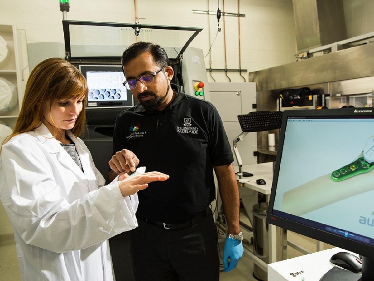 Technicians discussing 3D printed prosthetic