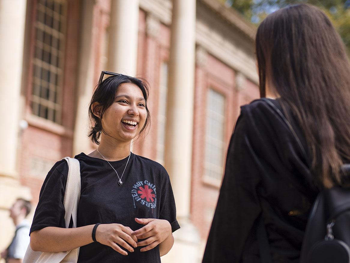 Students smiling in front of the Barr Smith Library