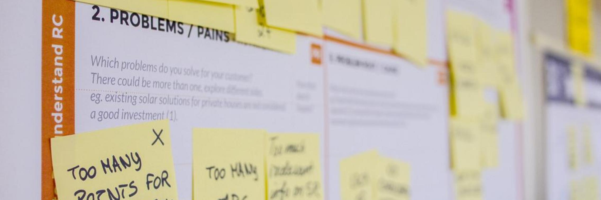 post it notes on a whiteboard