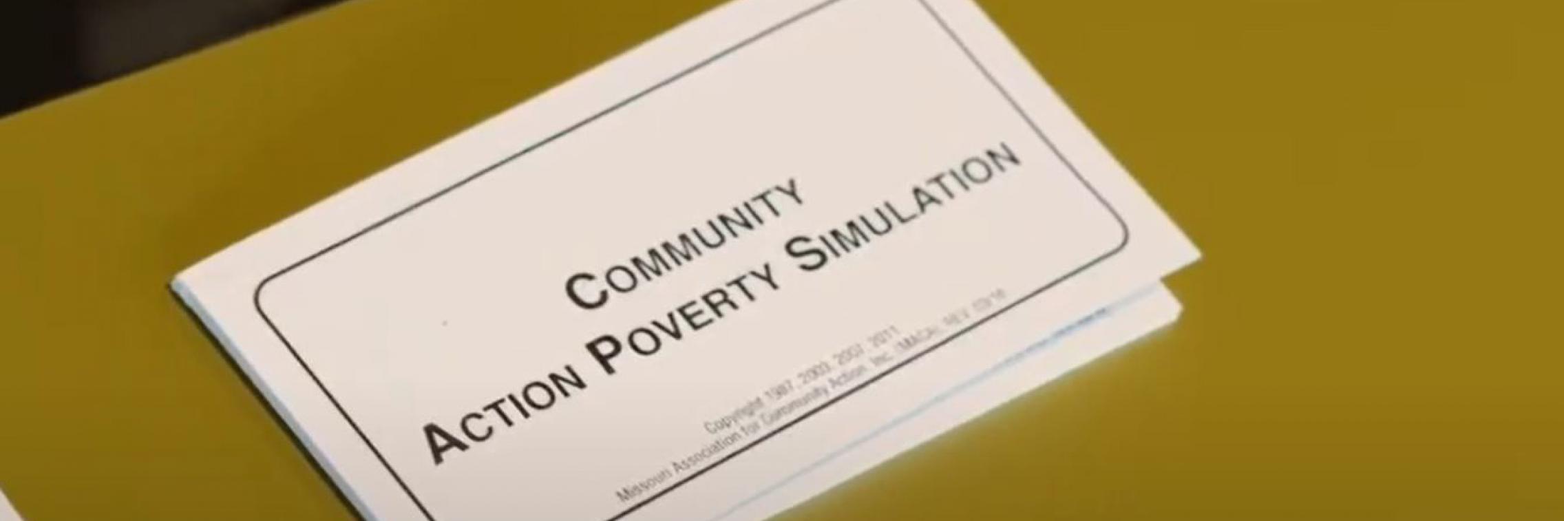 Community Action Poverty Simulation workbook on a table