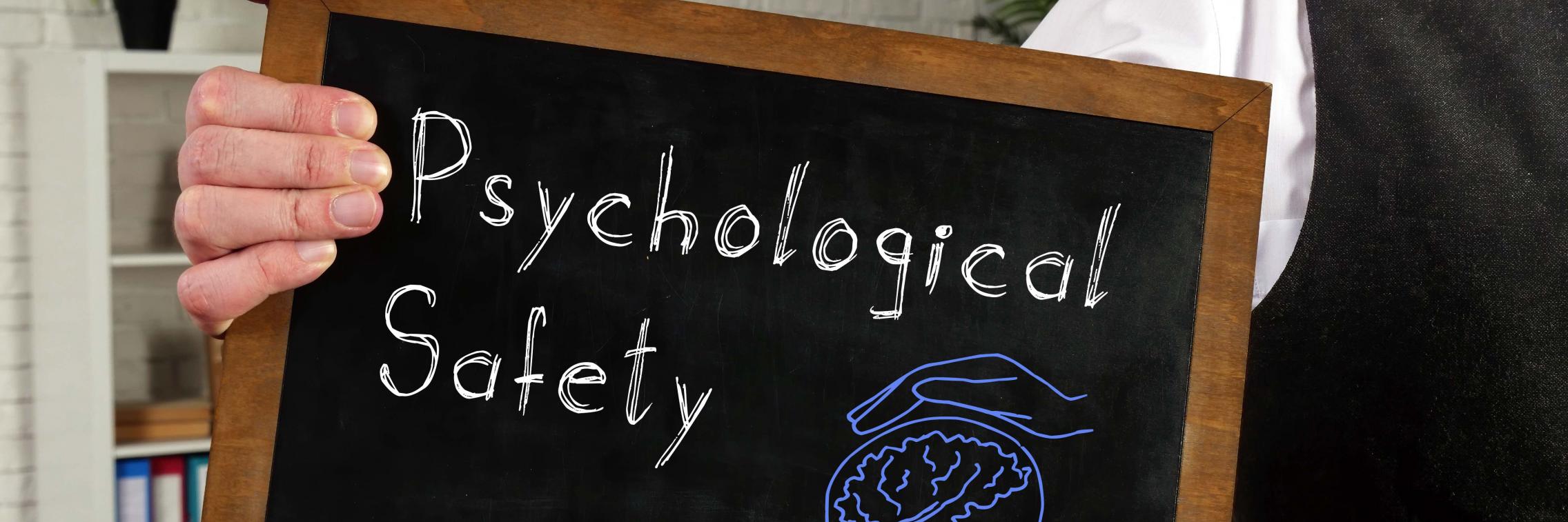 A chalk board with the words Psychological safety written on it
