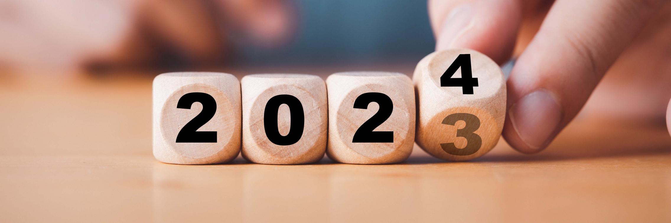 Four dice transforming from 2023 to 2024. 