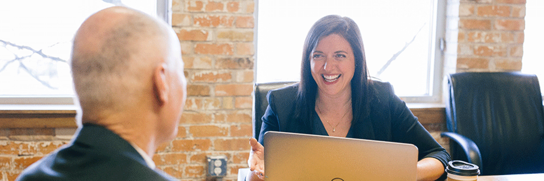 Two professionals engaging in a coaching and mentoring session
