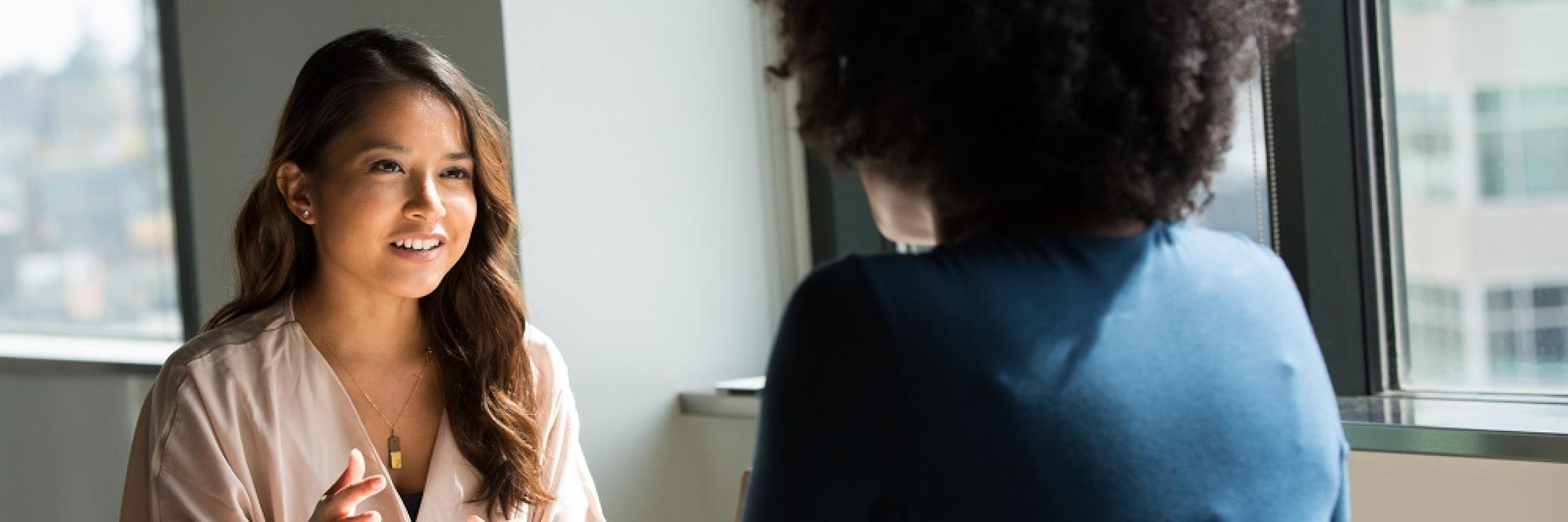 Two women having a meeting in an office.