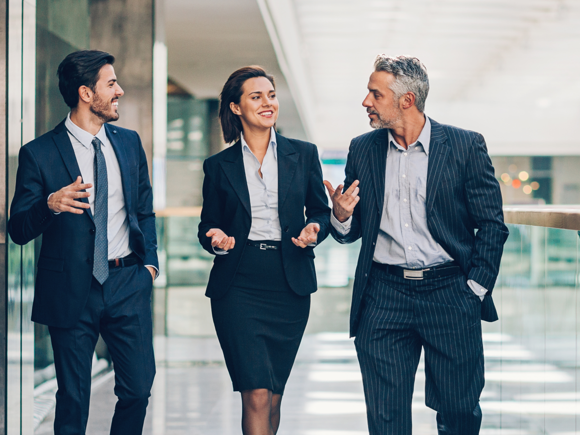 Group of professionals walking and talking