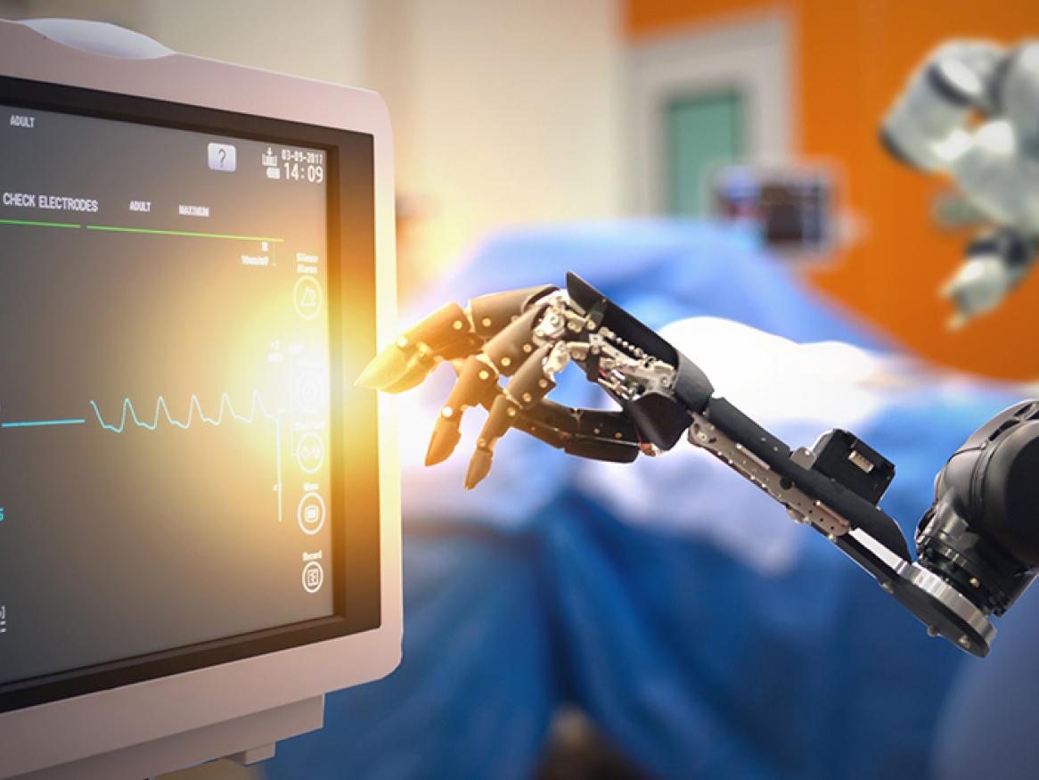 Robots arm reaching for a medical monitoring screen