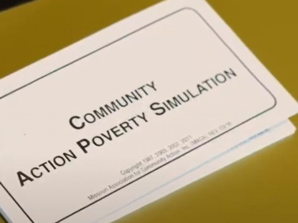 Community Action Poverty Simulation workbook on a table