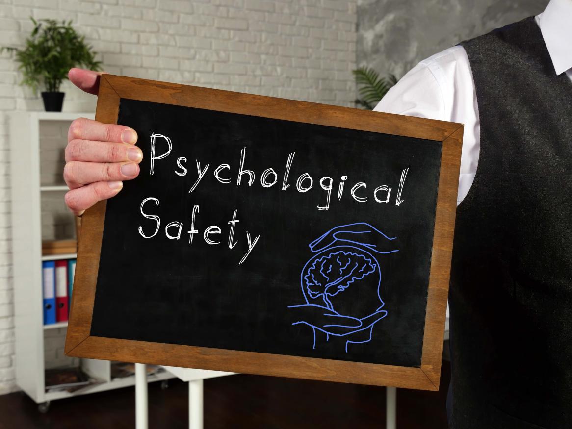 A chalk board with the words Psychological safety written on it