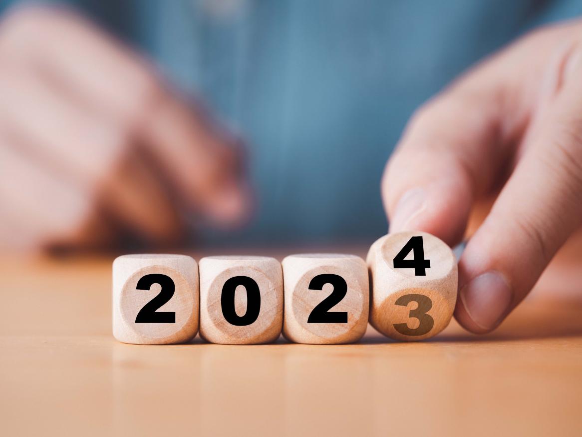 Four dice transforming from 2023 to 2024. 