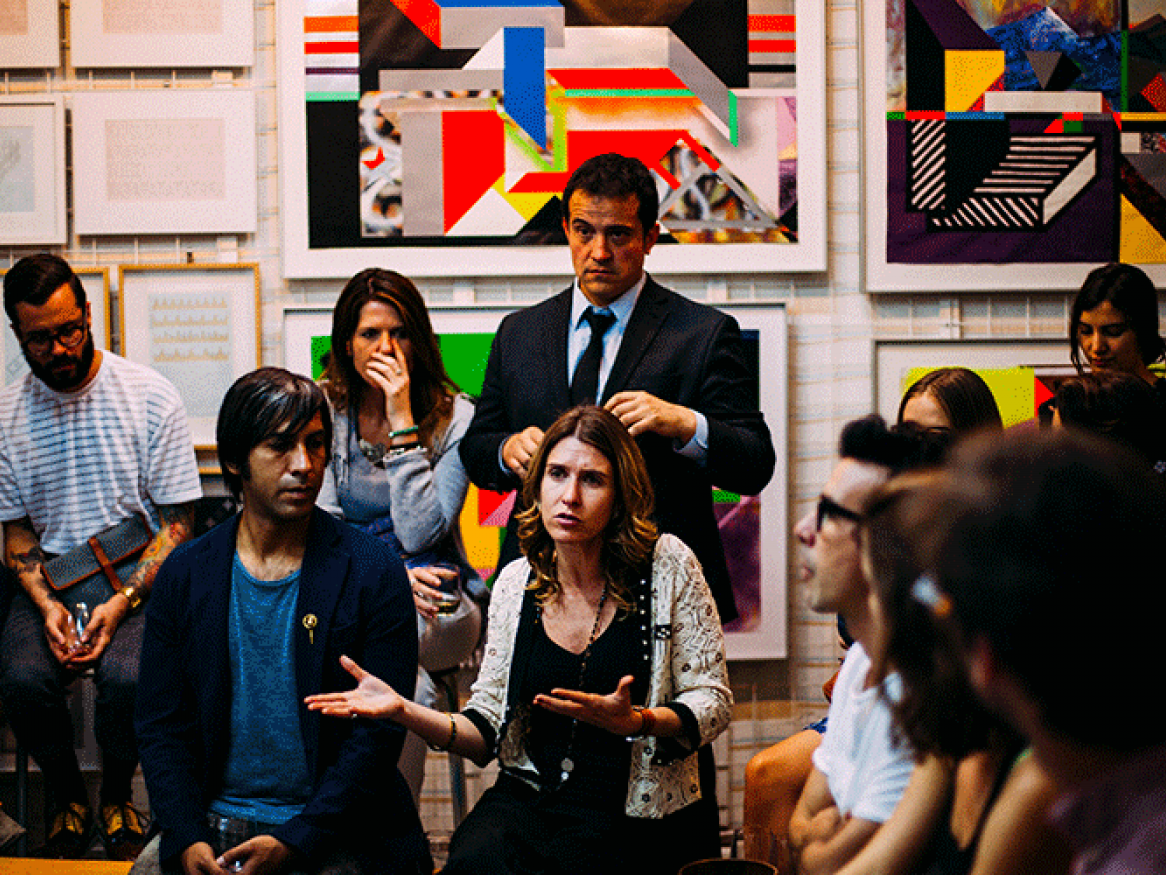 group of people listening to a key speaker