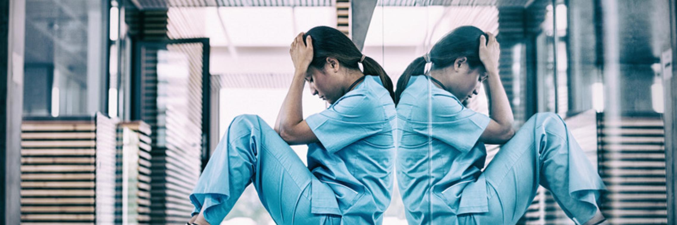 Nurse sitting on ground