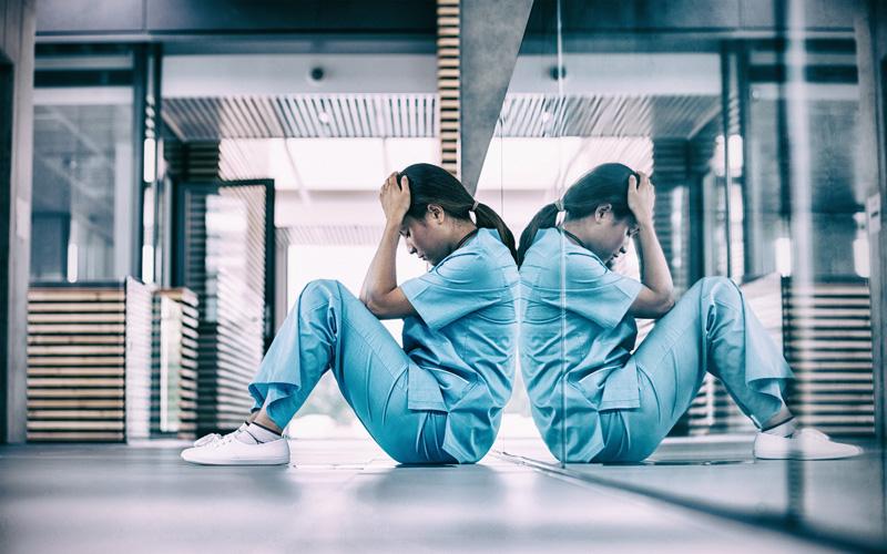 Nurse sitting on ground