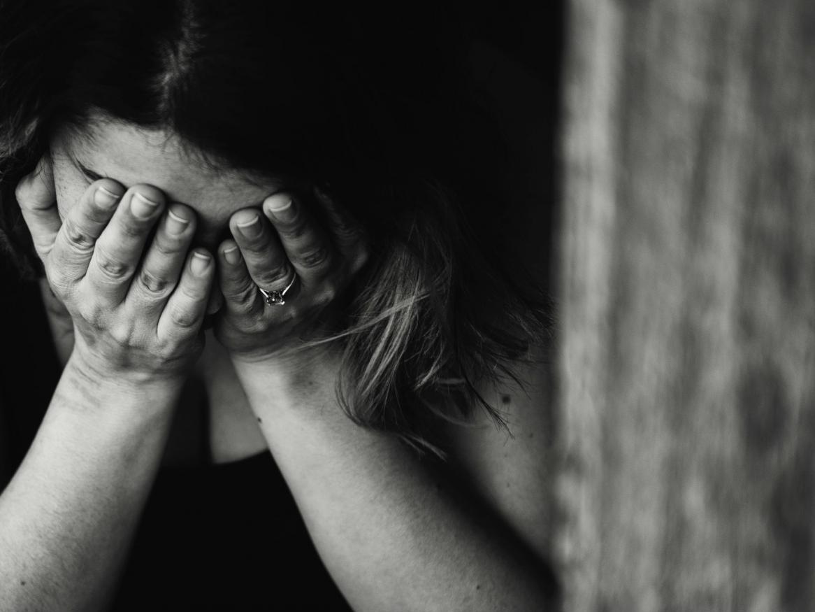 Adult, alone upset with anxiety, black and white