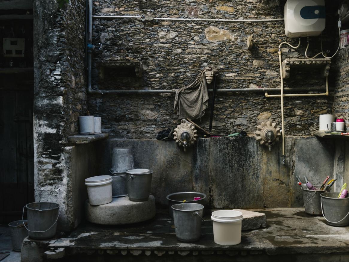 South asian laundry with buckets, harvesting rain water